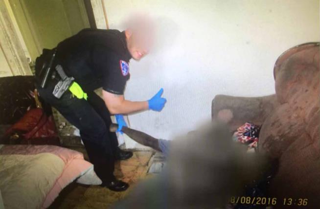In 'Hideous' Photo, Cop Gives Thumbs-Up Over Dead Body