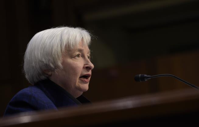 Fed Raises Key Interest Rate, Suggests More Hikes Coming