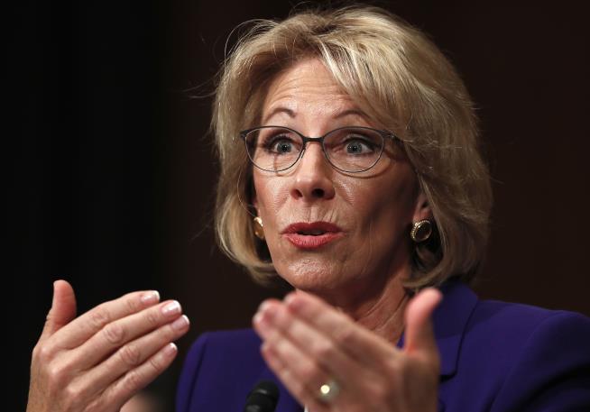 DeVos Clears Committee, but Controversy Dogs Her
