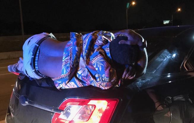 Man Drives 14 Miles With Guy Passed Out on Trunk