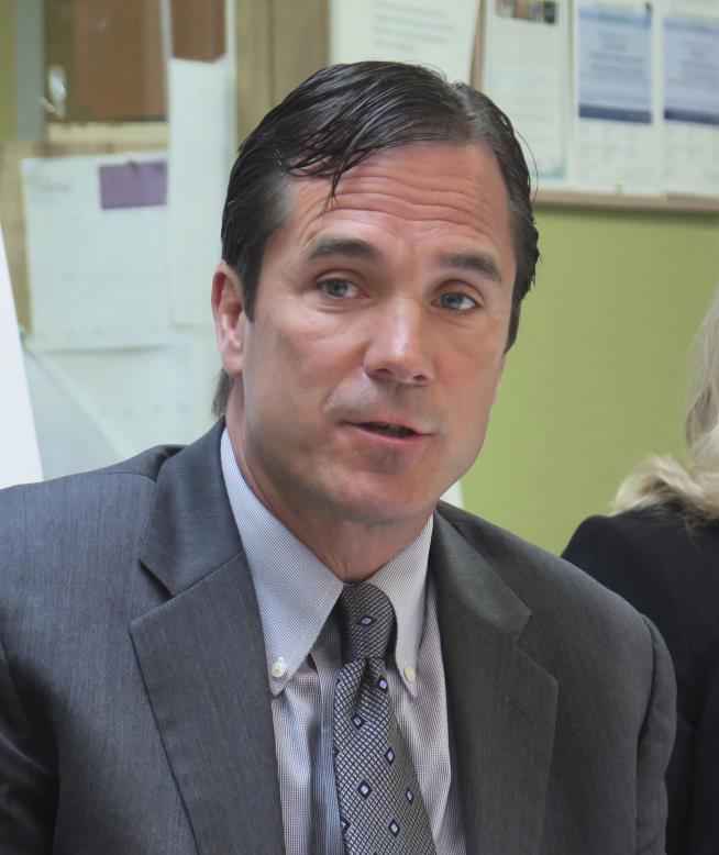 Michigan Health Chief Charged in Flint Death