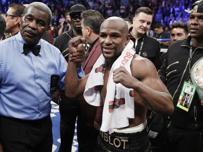 Mayweather Ends Mega-Fight 50-0, $200M Richer