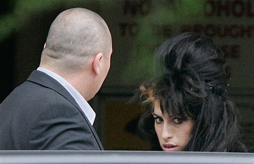 Winehouse Leaves Hospital... Smoking