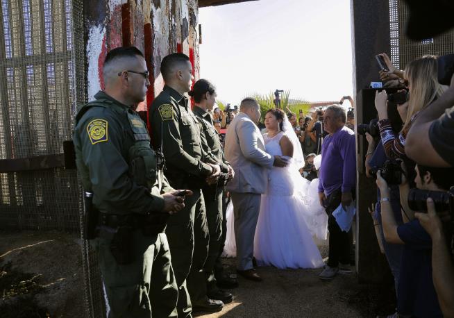 Couple Exchanges Vows Over Mexico-US Border