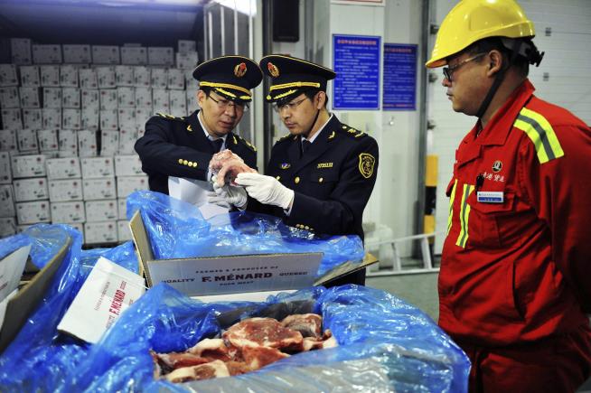 China Threatens Tariffs on US Pork, Wine, Apples