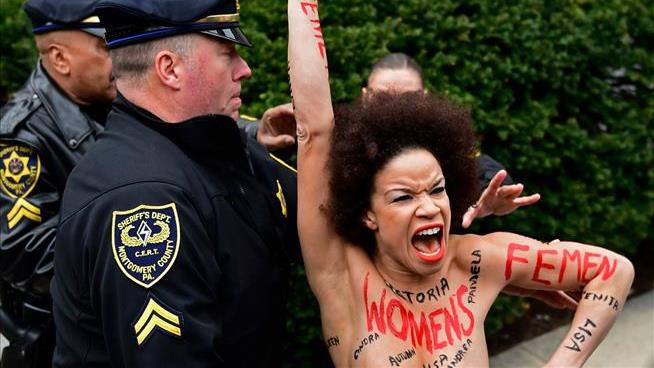 Topless Woman Barrels Toward Bill Cosby Outside Courthouse