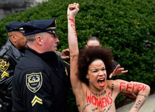 Topless Woman Barrels Toward Bill Cosby Outside Courthouse