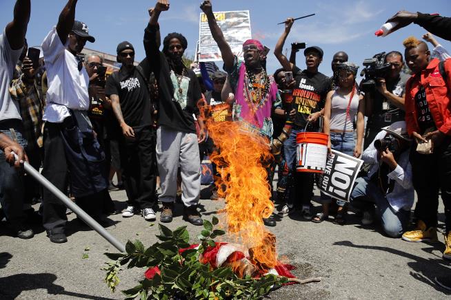 American Flag Is Burned Outside Maxine Waters' Office