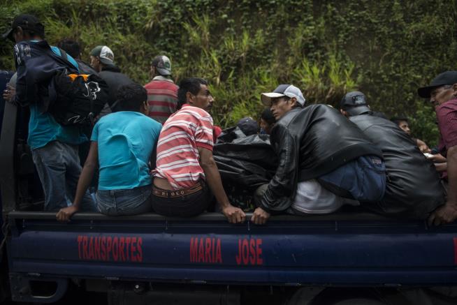 Migrants Break Fence at Guatemala-Mexico Border