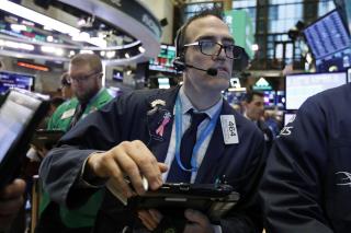 Stocks Surge After Fed Drops Hint