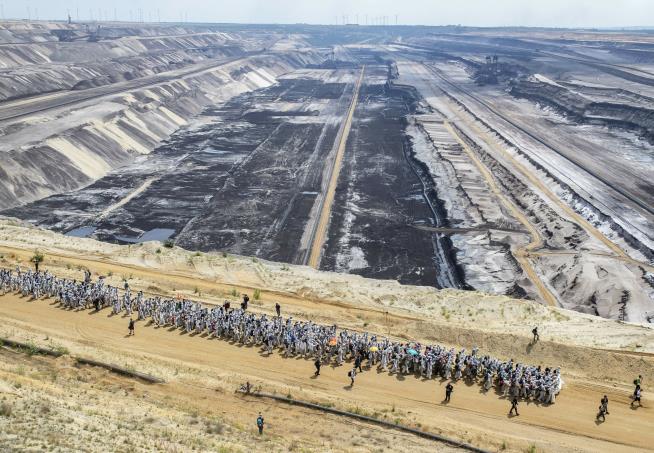 Protesters Storm Open-Pit Mine