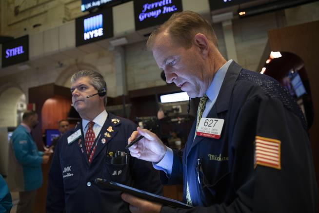 Stocks Sink, Then Recover After Fed Rate Cut