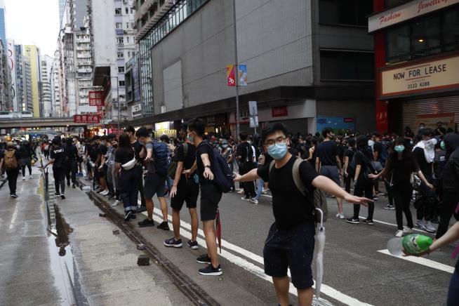 Protesters Flood Streets Despite Mask Ban