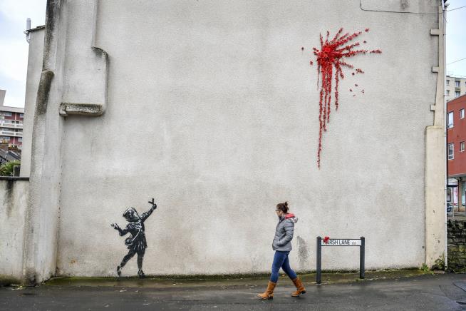 Someone Defaced Bansky's Valentine's Day Mural