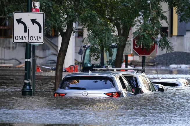 Apartment Complex Deaths Raise Flood Toll to 14