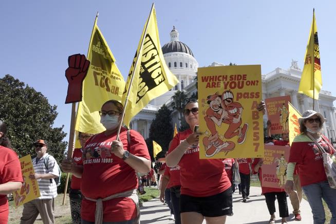 Newsom Signs Landmark Law for State's Fast-Food Workers