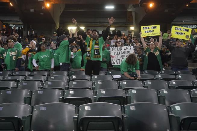 Fans Cheer A's but Not Owner