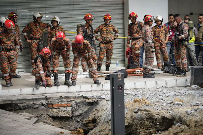 Tourist Vanishes in Kuala Lumpur Sinkhole Collapse