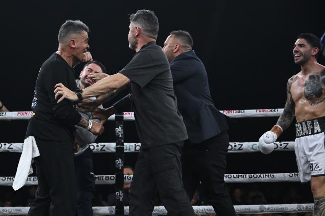 Boxer's Brother Punches Opponent's Trainer in Ring Melee