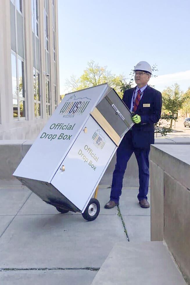 Mayor Carts Away Ballot Drop Box