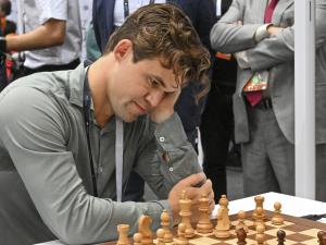 Chess Champion Out Over Blue Jeans Breach