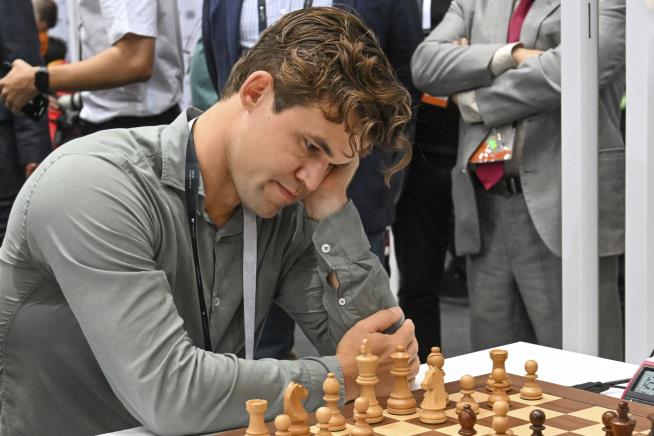 Chess Champion Out Over Blue Jeans Breach