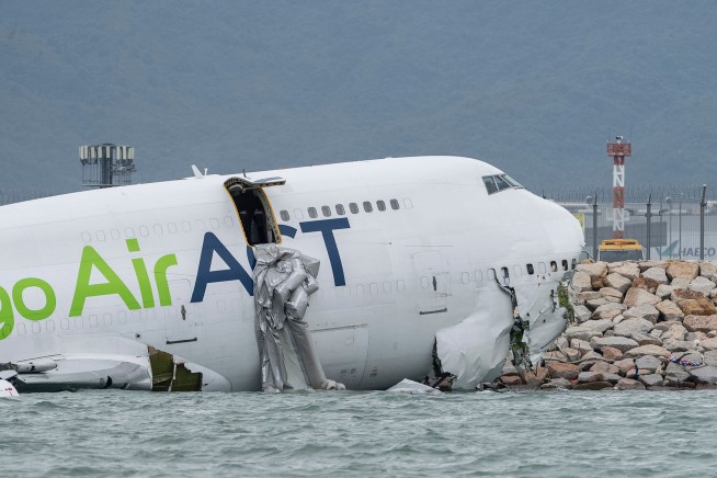 Cargo Plane Skids Off Runway Into Car, Both Fall Into Sea