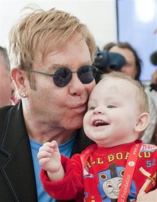 Elton Aims to Adopt 'Heart-Stealing' Ukraine Orphan