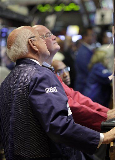 Dow Surges 132 as Dollar Falls