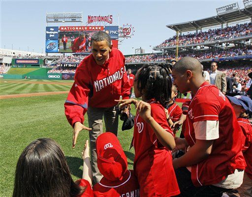 Khaki-Clad Obama Throws Out First Pitch