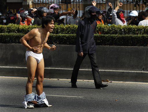 Thai Army Opens Fire; Protesters Strip