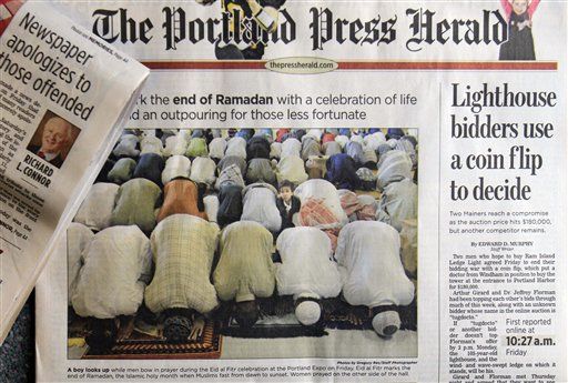 Paper: Sorry for Photo of Muslims Praying on 9/11