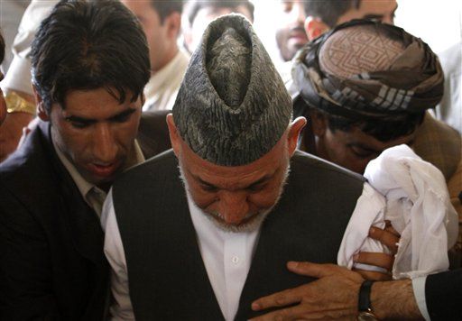 Weeping Hamid Karzai Climbs Into Half-Brother Ahmad Wali Karzai's Grave