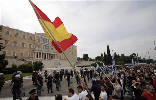 Moody's Downgrades Spain, Warns France