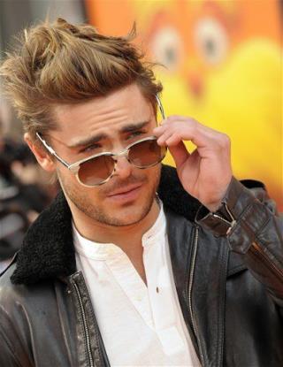 Zac Efron Drops Condom on Red Carpet