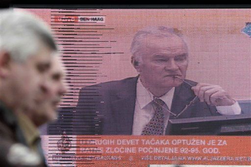 As Trial Begins, Mladic Taunts Survivors