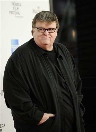 Michael Moore, Bigwigs Are Out $317K on Assange Bail