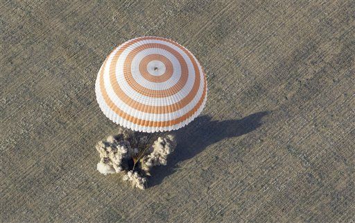 Yank, Russians Land Safely in Soyuz