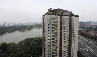 Man Must Tear Down Beijing's Wildest Illegal Structure