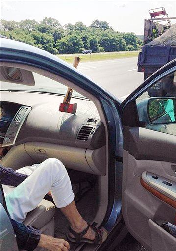 Flying Highway Hatchet Lodges in Car's Dashboard