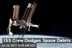 International Space Station: Crew Boards Escape Pods Because of Space Debris