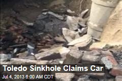 Toledo Sinkhole Claims Car