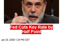 Fed Cuts Key Rate by Half Point