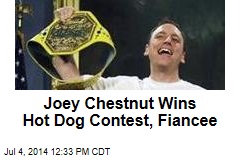 Joey Chestnut Wins Hot Dog Contest, Fiancee