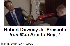 Robert Downey Jr. Presents Iron Man Arm to Boy, 7