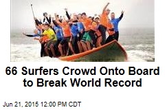 66 Surfers Crowd Onto Board to Break World Record
