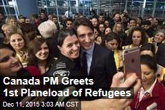 Canada PM Greets 1st Planeload of Refugees