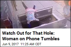 Watch Out for That Hole: Woman on Phone Tumbles