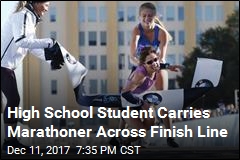 High School Student Carries Marathoner Across Finish Line