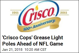 &#39;Crisco Cops&#39; Grease Light Poles Ahead of NFL Game